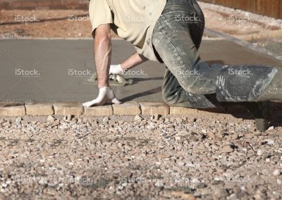 stock-photo-16630842-driveway-construction-smoothing-the-concrete