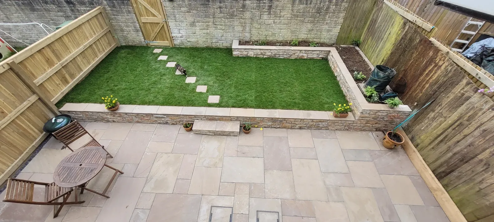 Garden renovation in Paulton with Raj sandstone patio and rough stone walling