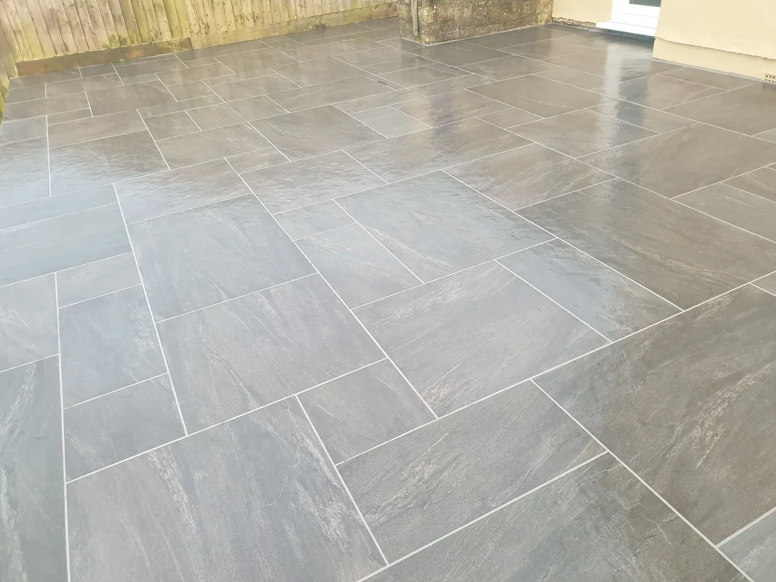 Anthracite mixed size porcelain patio installation in Westfield